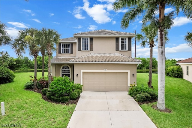 mediterranean / spanish house with a garage and a front lawn