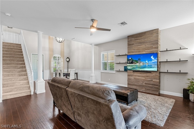 living room featuring dark hardwood / wood-style flooring, ornate columns, a wealth of natural light, and ceiling fan