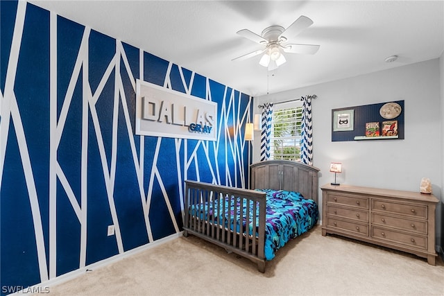 carpeted bedroom with ceiling fan