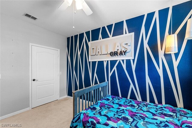 carpeted bedroom with ceiling fan