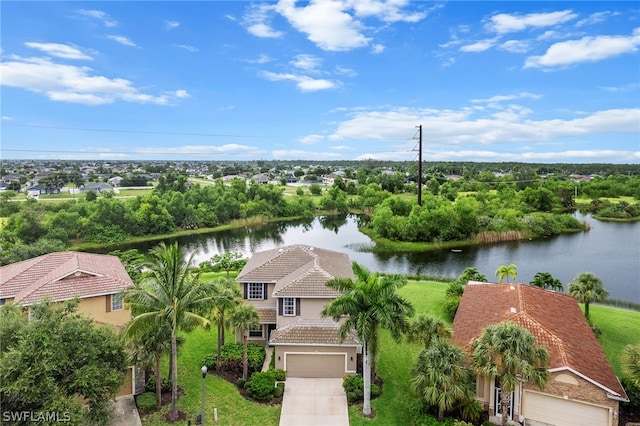 drone / aerial view with a water view