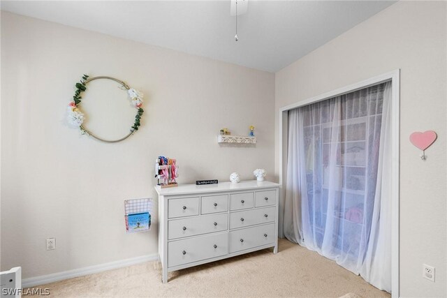 bedroom featuring light colored carpet