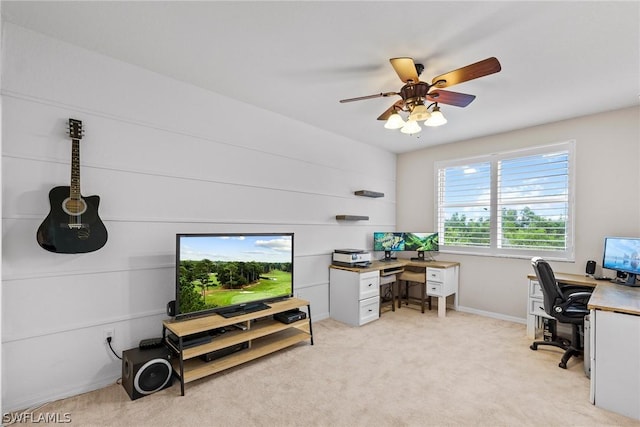 carpeted home office with ceiling fan