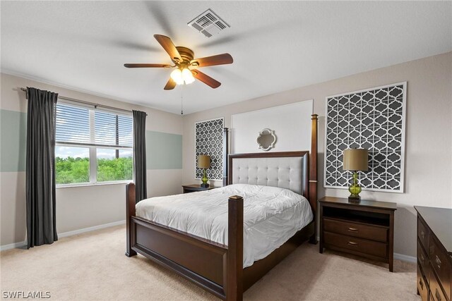 bedroom with light carpet and ceiling fan