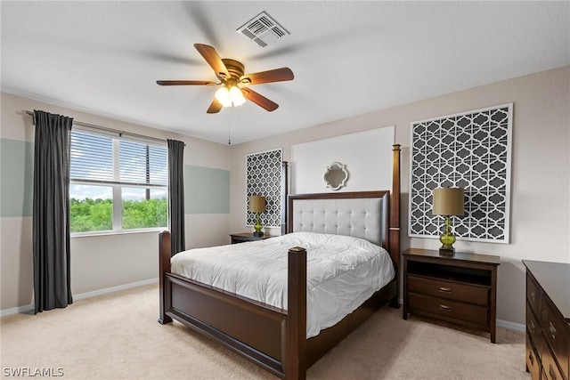 bedroom featuring light carpet and ceiling fan