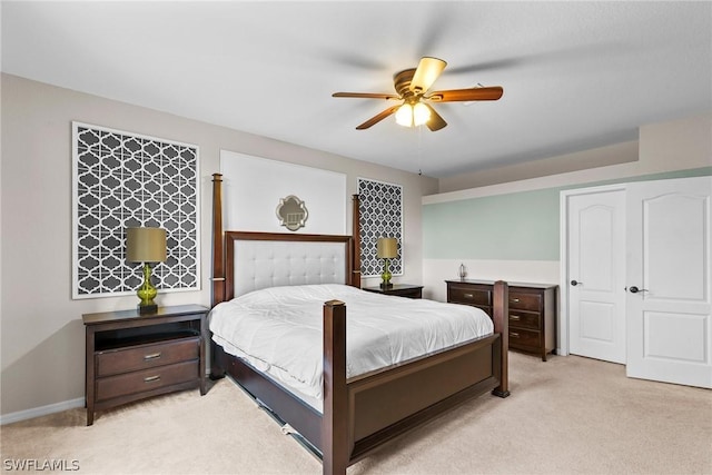 bedroom with ceiling fan and light colored carpet