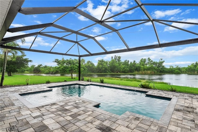 view of swimming pool with a patio area, a water view, pool water feature, and glass enclosure