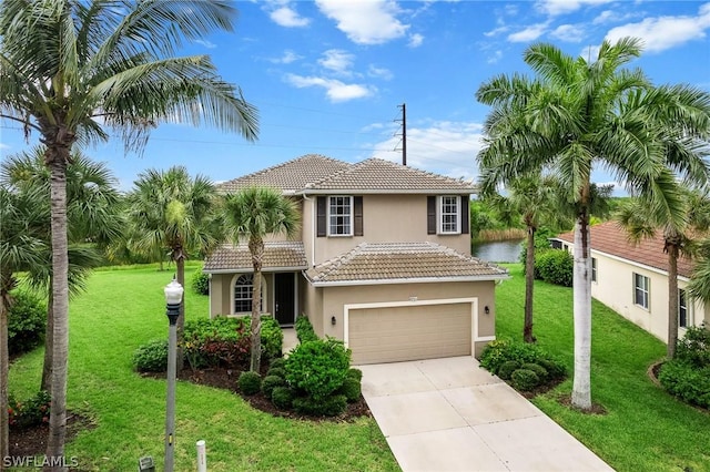 mediterranean / spanish-style home with a garage and a front yard