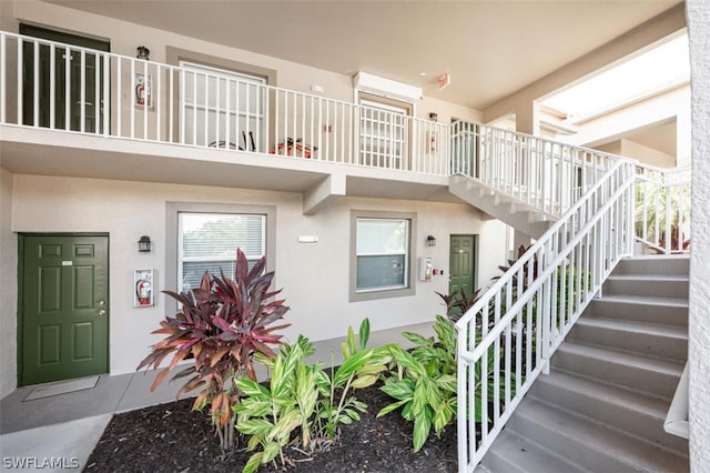 entrance to property with a balcony