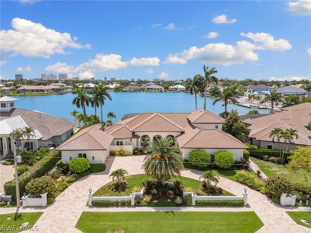 birds eye view of property with a water view