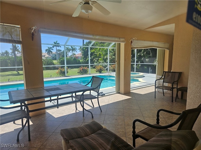 view of pool featuring ceiling fan, a lanai, and a patio area