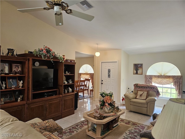 tiled living room with ceiling fan