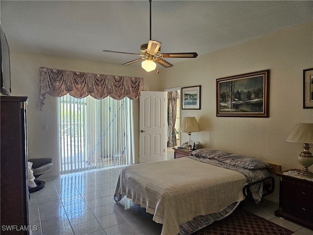 tiled bedroom featuring ceiling fan and access to outside