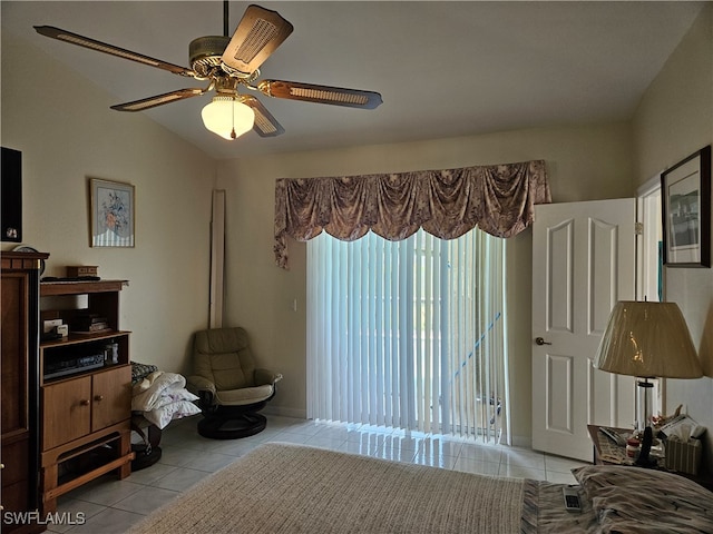 bedroom featuring ceiling fan, light tile patterned flooring, and lofted ceiling