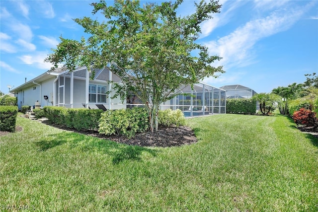 view of yard featuring a lanai