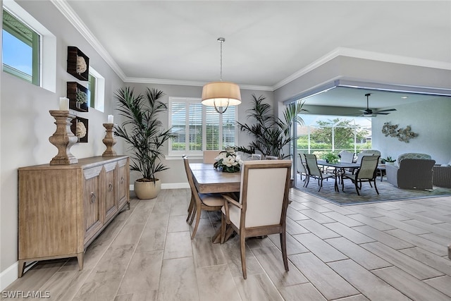 dining area featuring ornamental molding and ceiling fan