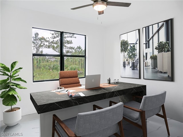 office with ceiling fan and plenty of natural light