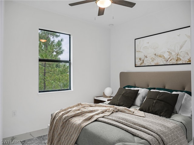 bedroom with carpet flooring, multiple windows, and ceiling fan