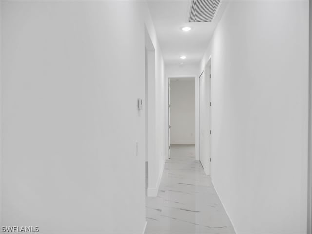 hallway featuring light tile patterned floors