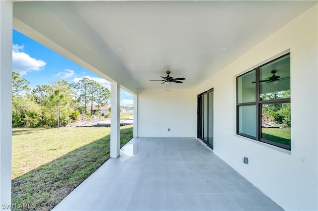 view of patio featuring ceiling fan