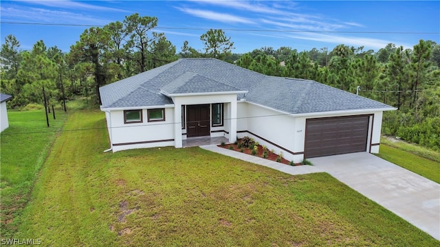 view of front facade with a garage and a front yard