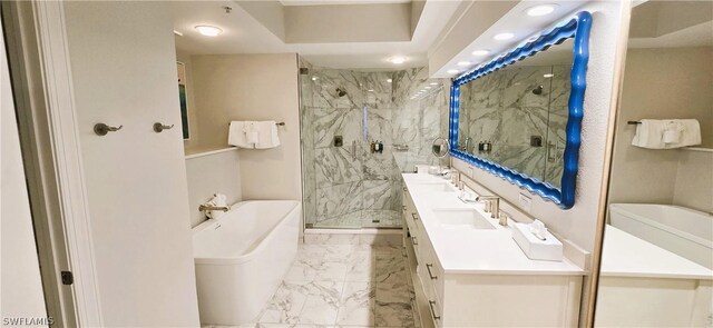 bathroom featuring vanity and separate shower and tub