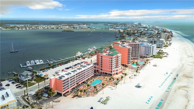 bird's eye view with a water view and a view of the beach