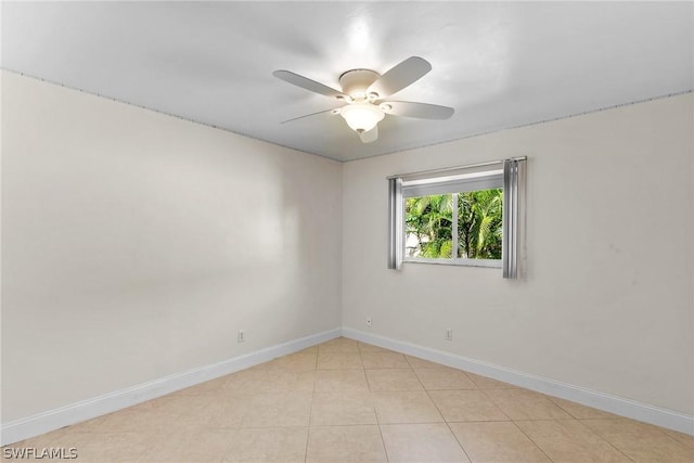 unfurnished room with light tile patterned floors and ceiling fan