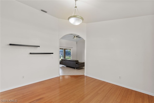 unfurnished room featuring hardwood / wood-style flooring and ceiling fan