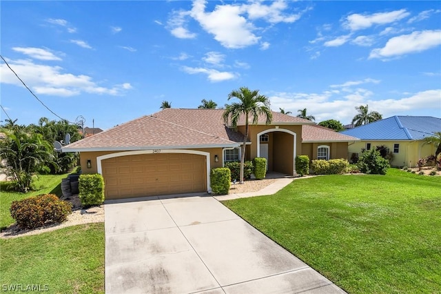 view of front of house featuring a garage and a front yard