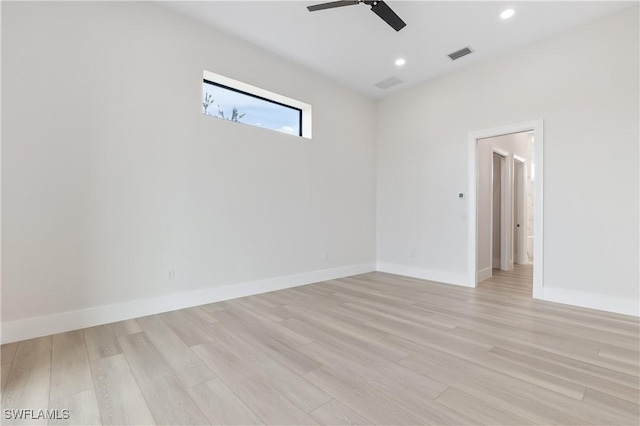 empty room featuring light hardwood / wood-style flooring and ceiling fan