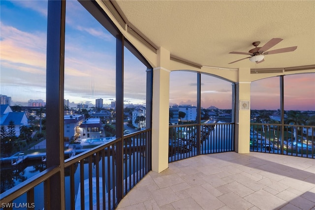 sunroom with ceiling fan