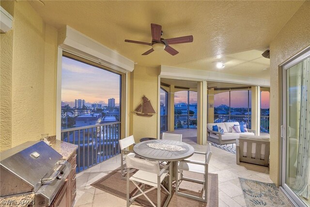 sunroom / solarium with ceiling fan