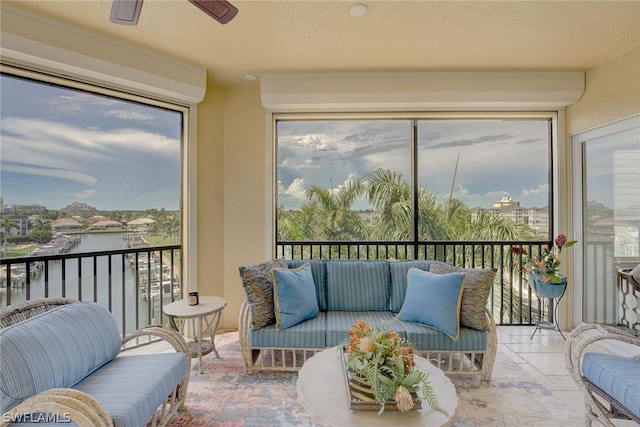 sunroom featuring ceiling fan