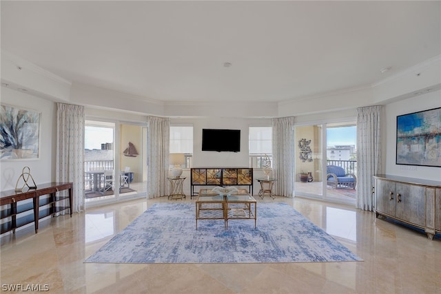 tiled living room with crown molding and a wealth of natural light