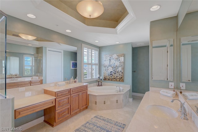 bathroom with a relaxing tiled tub, tile patterned flooring, and a wealth of natural light