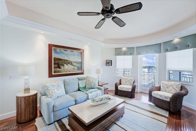 living room with ceiling fan and hardwood / wood-style floors