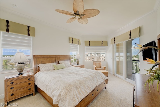 bedroom featuring access to outside, light colored carpet, crown molding, and ceiling fan