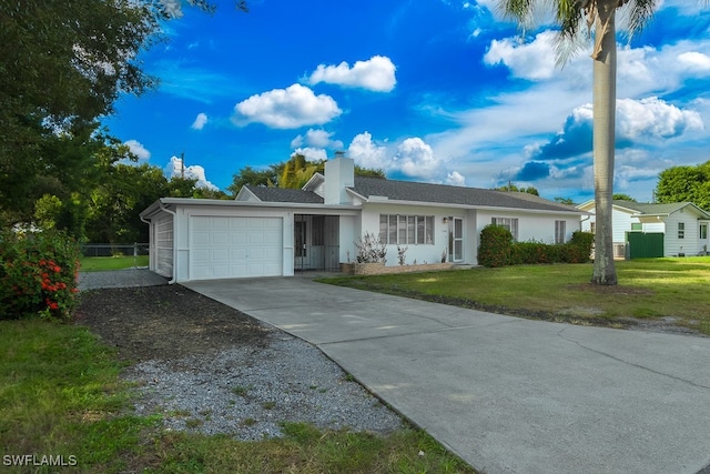 ranch-style home with a front yard and a garage