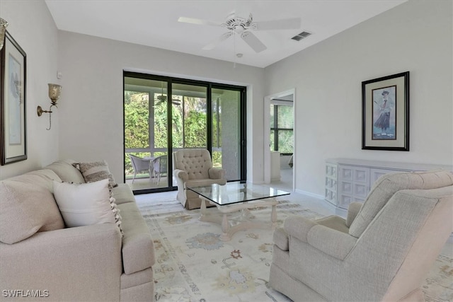 7685 Meadow Lakes Dr Unit 1301, Naples, FL 34104 - living area with ceiling fan, baseboards, and carpet