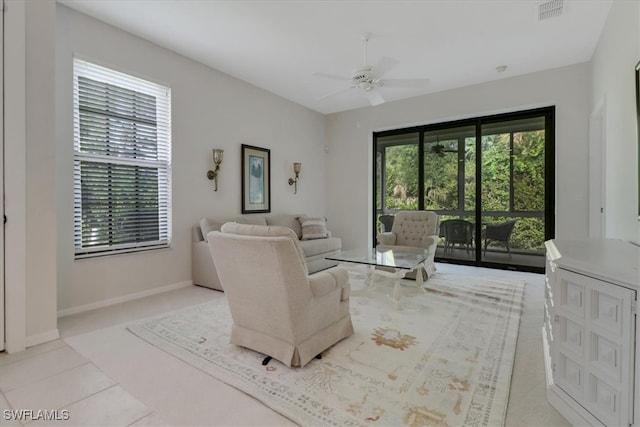 7685 Meadow Lakes Dr Unit 1301, Naples, FL 34104 - living room featuring a ceiling fan and baseboards