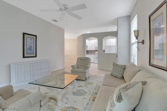 7685 Meadow Lakes Dr Unit 1301, Naples, FL 34104 - living area featuring a ceiling fan, baseboards, and tile patterned flooring
