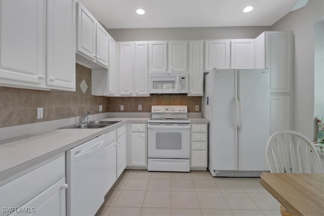 7685 Meadow Lakes Dr Unit 1301, Naples, FL 34104 - kitchen featuring white appliances, a sink, white cabinetry, light countertops, and recessed lighting