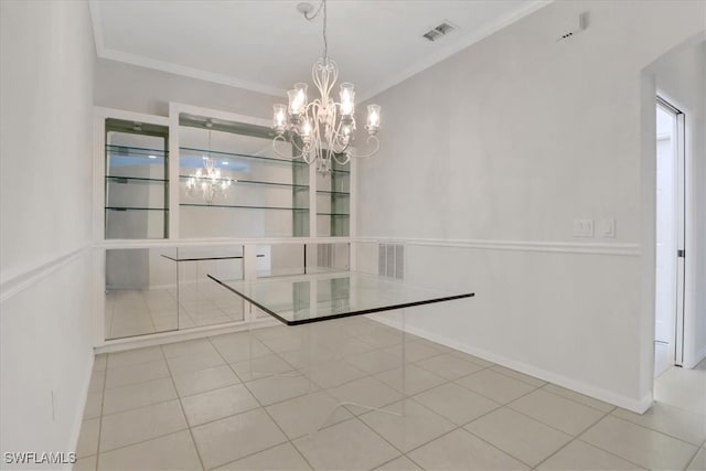 7685 Meadow Lakes Dr Unit 1301, Naples, FL 34104 - unfurnished dining area with a chandelier, ornamental molding, tile patterned flooring, and baseboards
