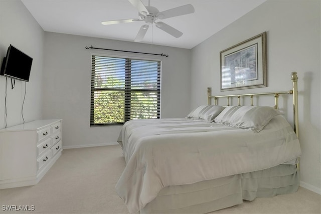 7685 Meadow Lakes Dr Unit 1301, Naples, FL 34104 - bedroom with light colored carpet, baseboards, and ceiling fan