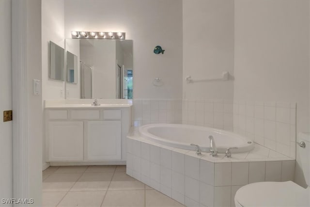 7685 Meadow Lakes Dr Unit 1301, Naples, FL 34104 - bathroom featuring a garden tub, vanity, toilet, a stall shower, and tile patterned floors