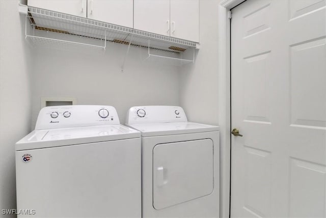 7685 Meadow Lakes Dr Unit 1301, Naples, FL 34104 - laundry area featuring washer and dryer and cabinet space