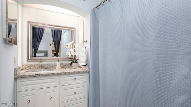 bathroom with vanity and a shower with curtain