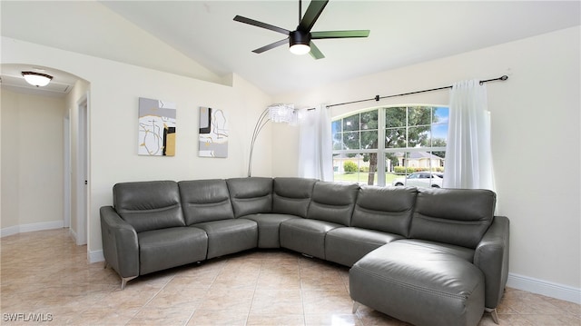 living room with lofted ceiling, ceiling fan, and light tile patterned floors