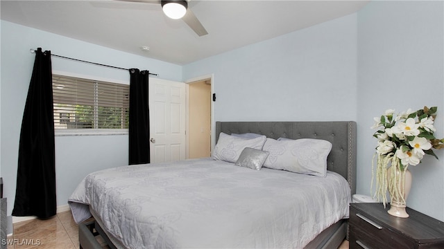 tiled bedroom with ceiling fan